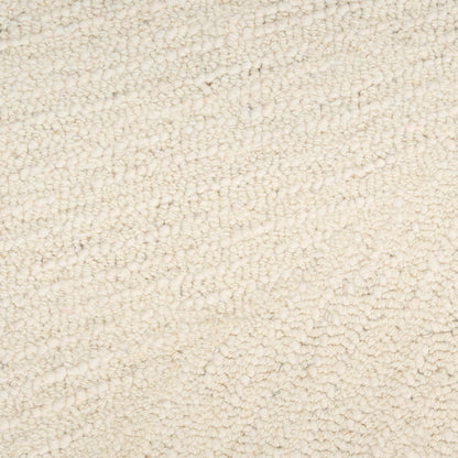 Beige plush rug texture with a dense loop pile; warm neutral floor covering.