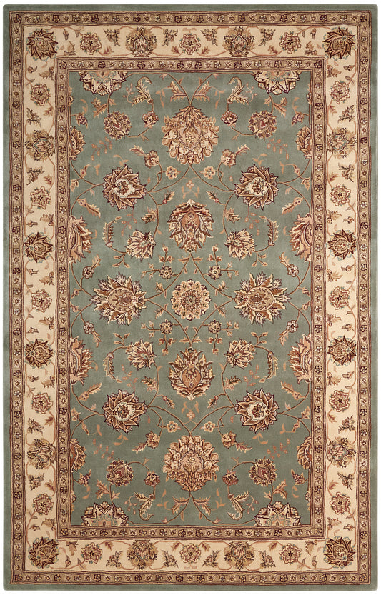 Rectangular Persian-style area rug with teal center, cream border and brown floral motifs.