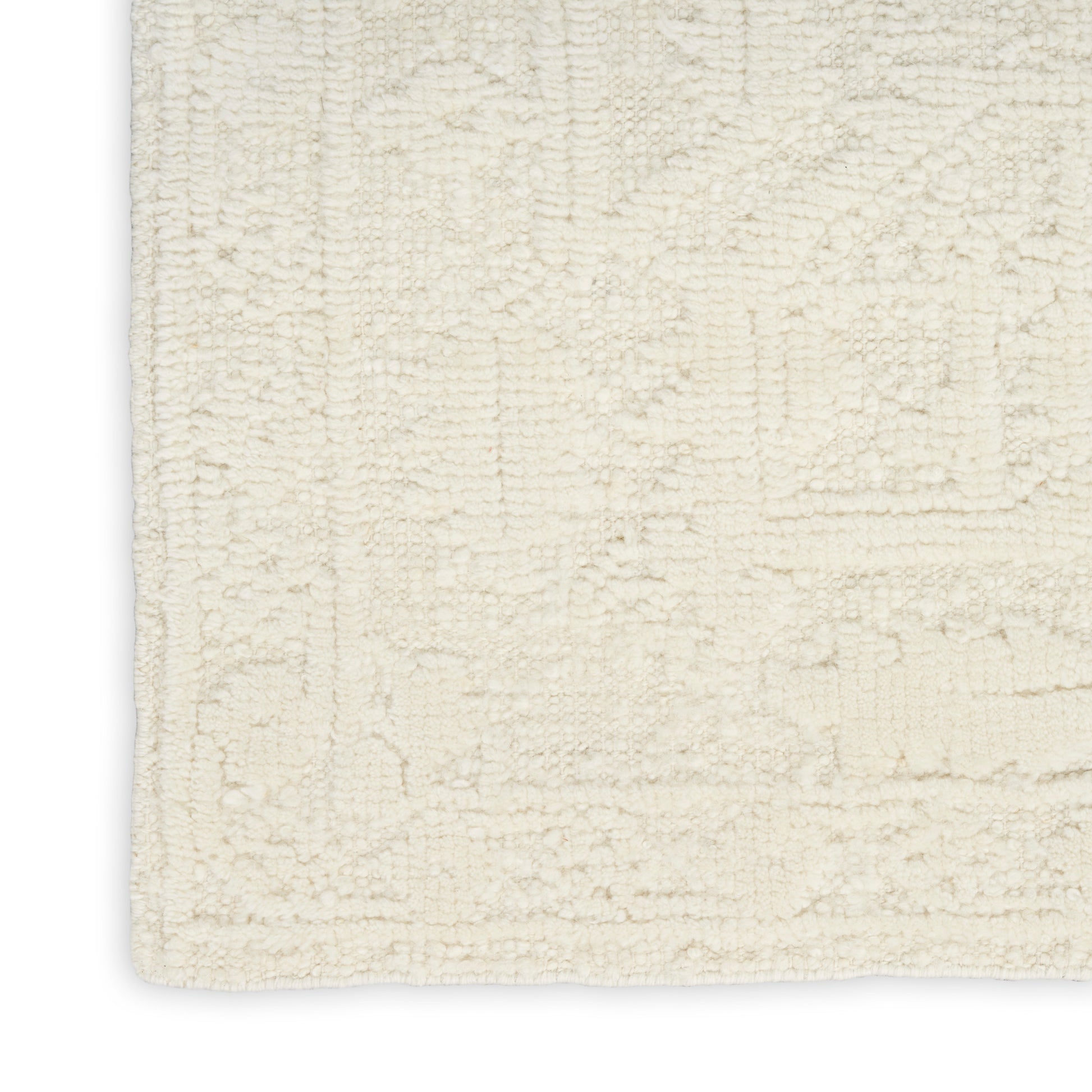 Cream textured rug with a subtle geometric pattern and soft pile; rectangular, neutral decor for living spaces.