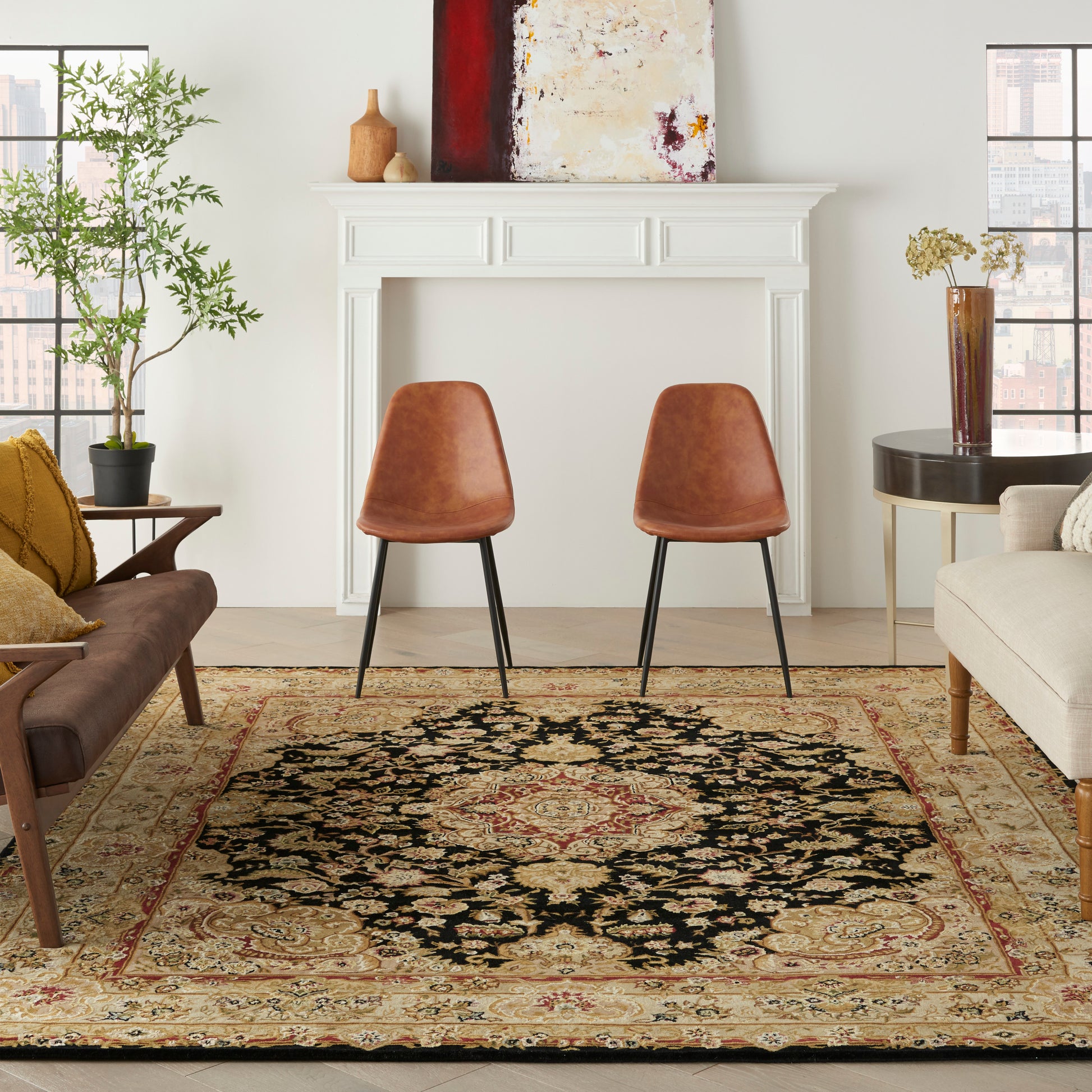 Living room scene with two brown leather chairs, a beige sofa, a white mantel, and an ornate Persian rug.