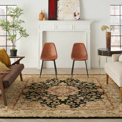 Living room scene with two brown leather chairs, a beige sofa, a white mantel, and an ornate Persian rug.