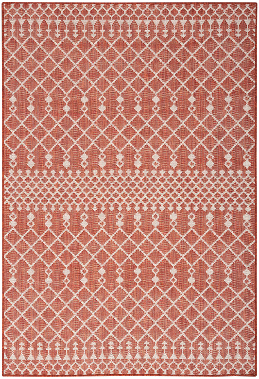 Terracotta area rug with white lattice diamonds and dotted borders; woven geometric pattern for modern decor.