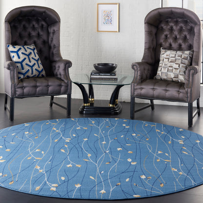 Blue round rug with leaf pattern, 8' diameter.