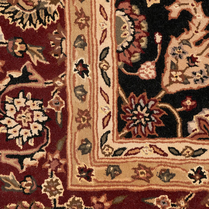 Persian-style oriental rug with burgundy field, ornate floral medallions, cream-beige border, gold and green accents.