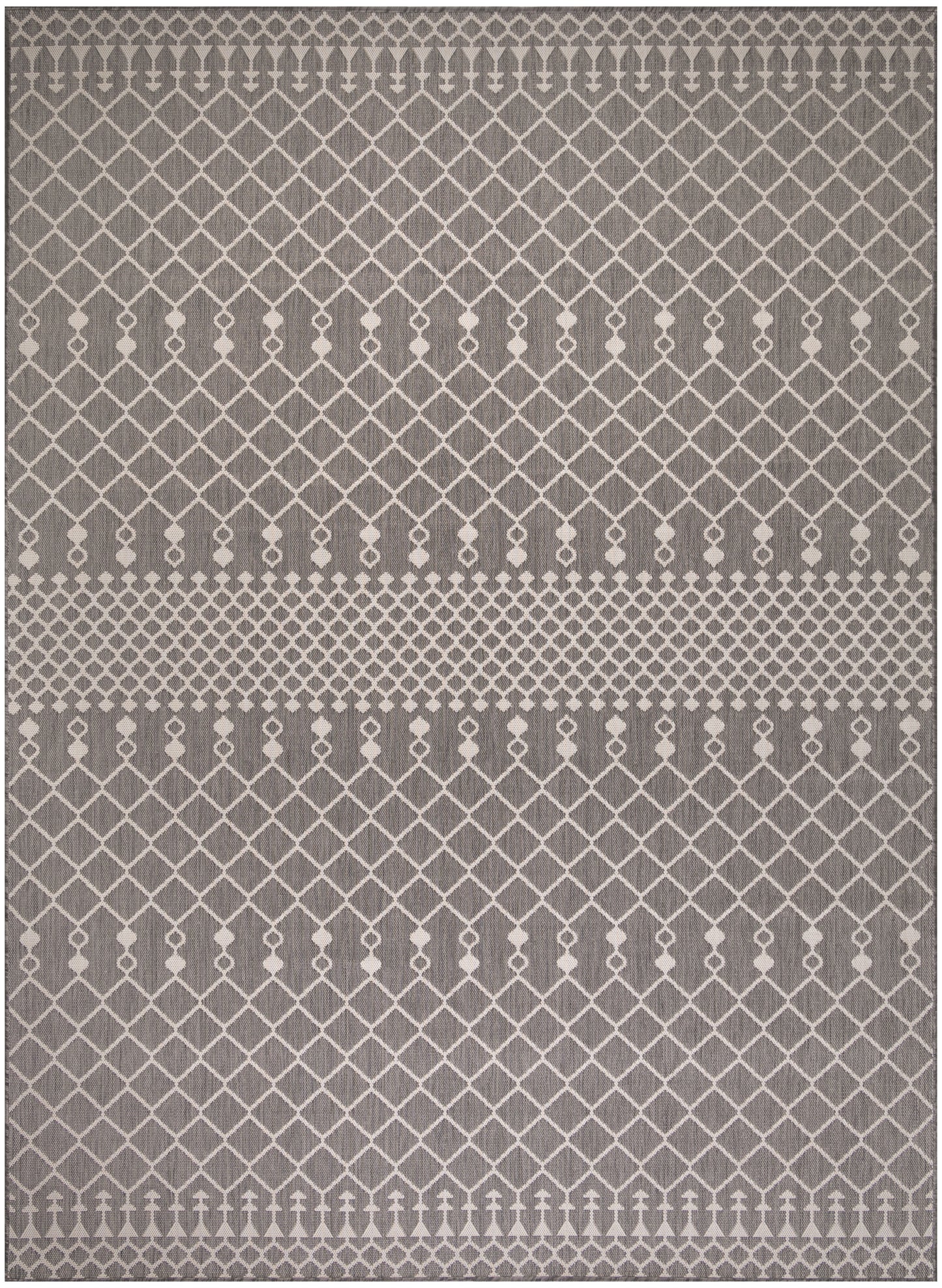 Grey area rug with white diamond lattice pattern and a central dotted stripe for a modern neutral look.