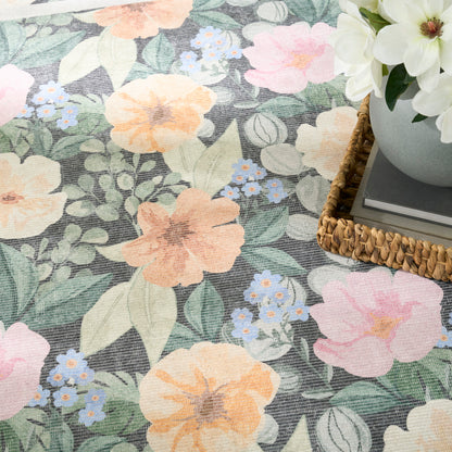 Pastel floral pattern with peach, pink and blue blossoms and green leaves; woven basket with white flowers.
