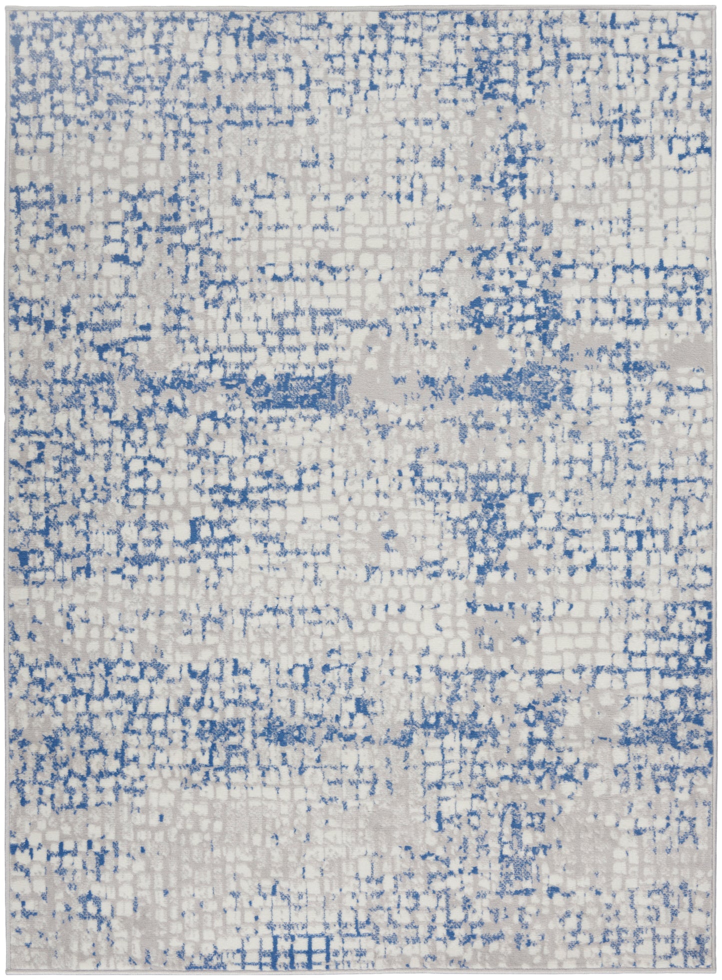 Rectangular area rug with cream base and blue distressed pixel pattern; modern abstract rug.