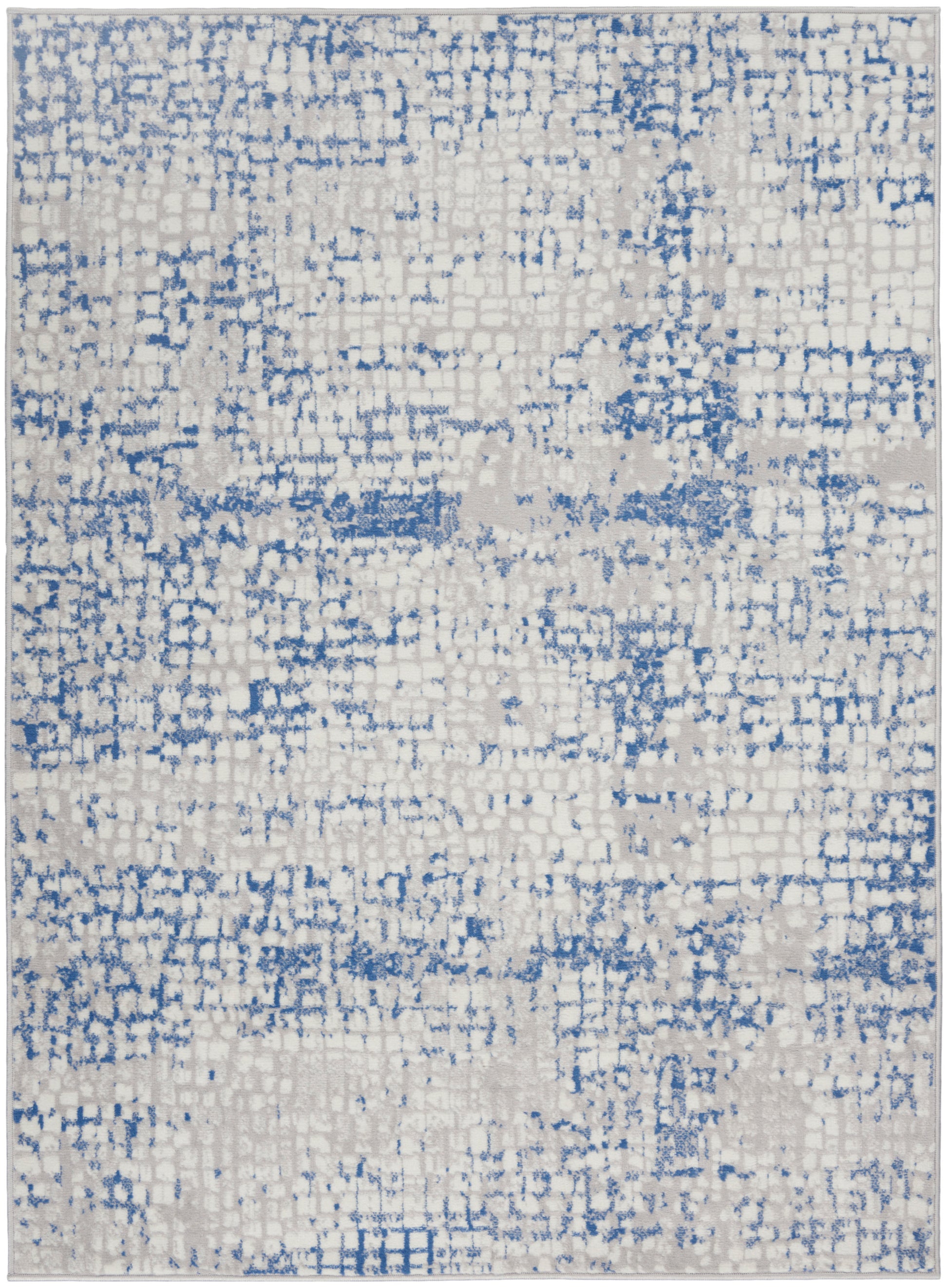 Rectangular area rug with cream base and blue distressed pixel pattern; modern abstract rug.