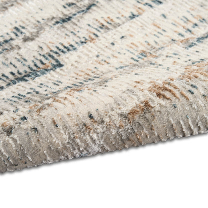 Cream and taupe plush area rug with blue-gray abstract linear pattern; soft high-pile, modern decor.