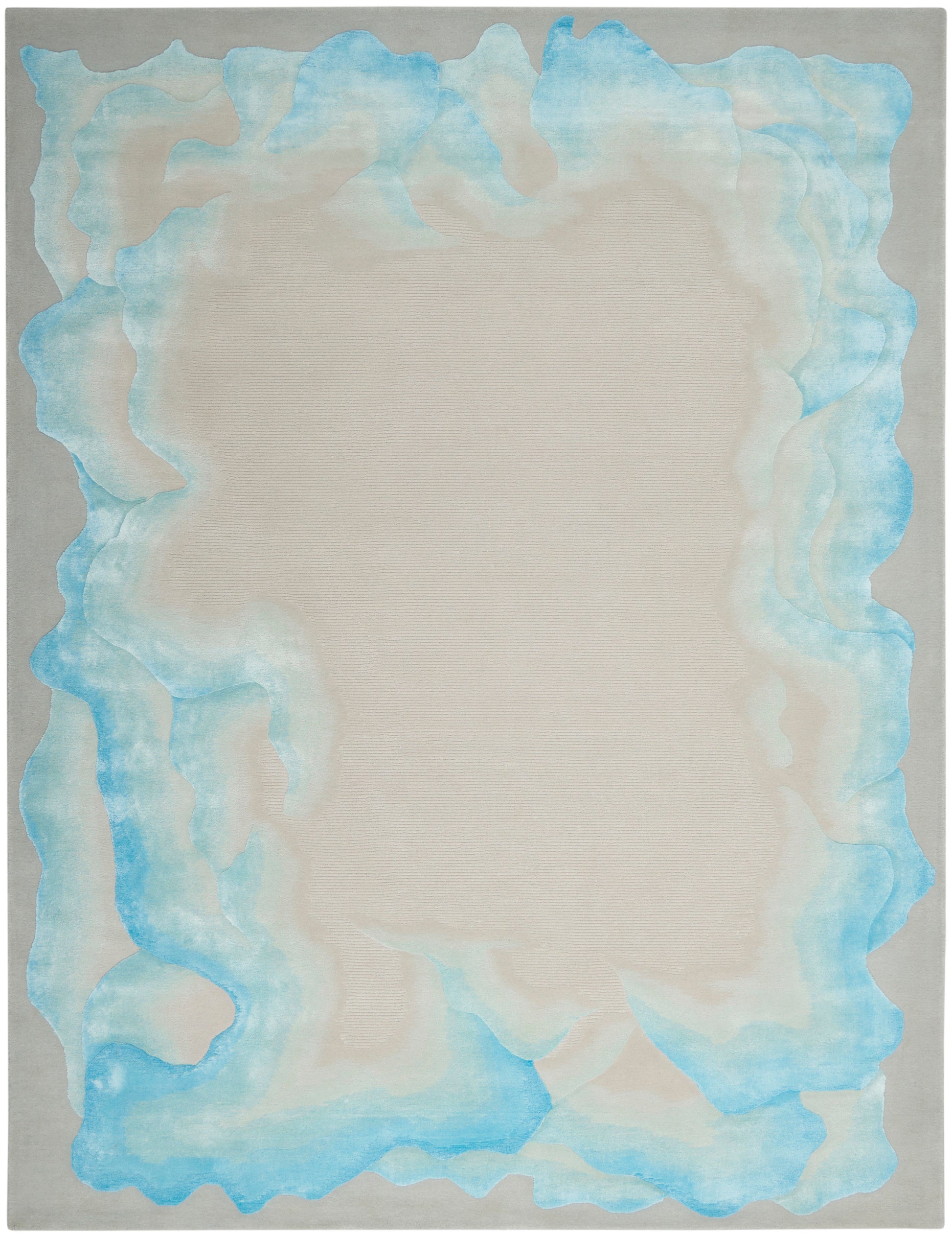 Beige central area rug with irregular pale blue watercolor border on light gray background.