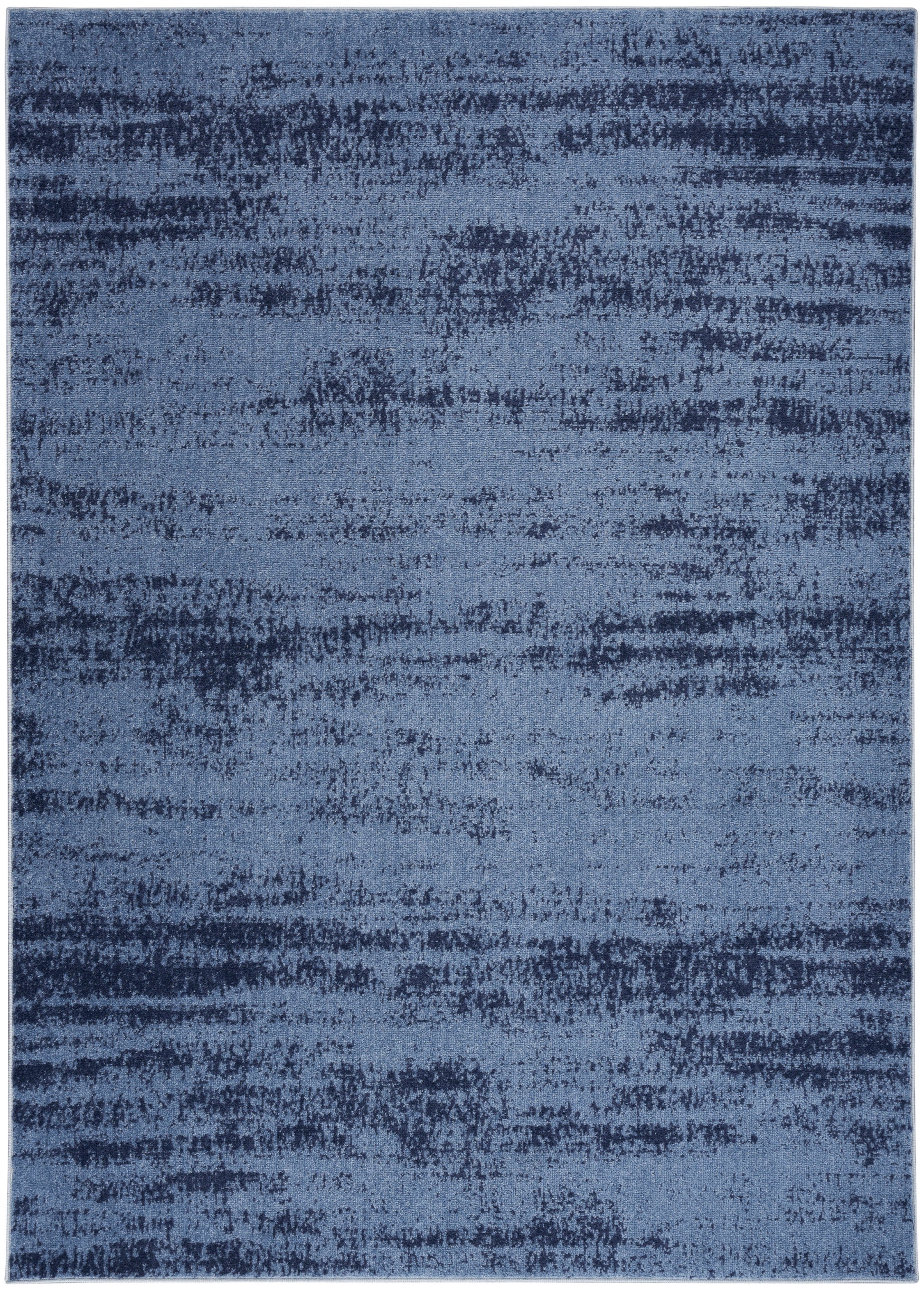 Blue abstract area rug with irregular navy and light-blue brushstroke pattern.