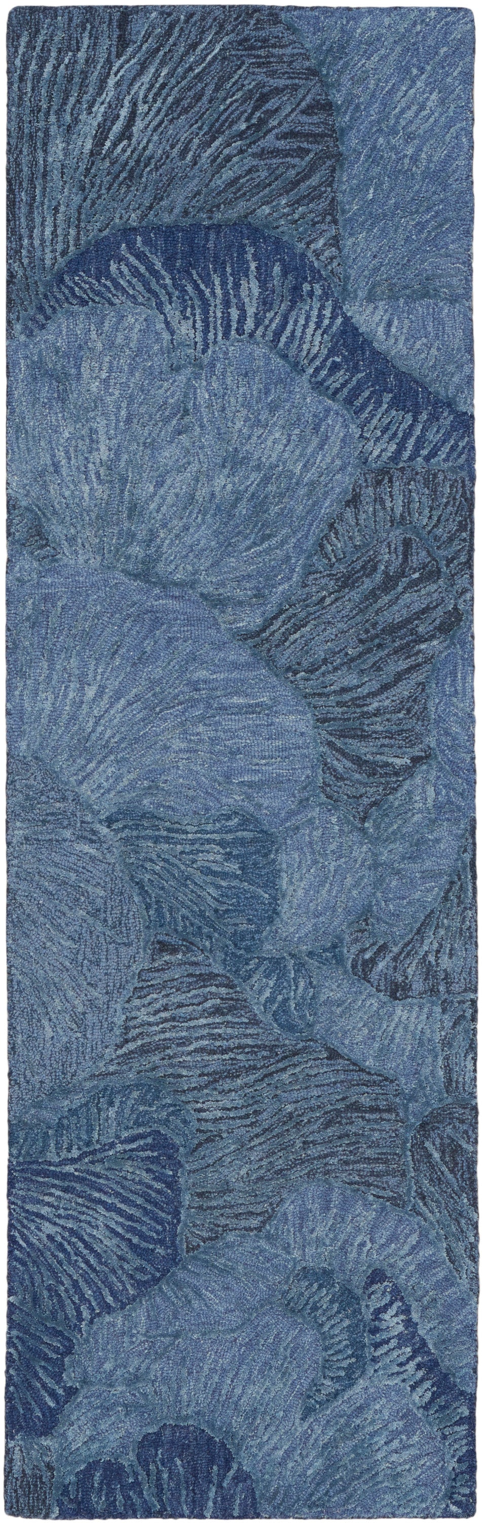 Blue patterned fabric with shell-like wave motifs in denim shades; long rectangular, soft velvet-like textile.