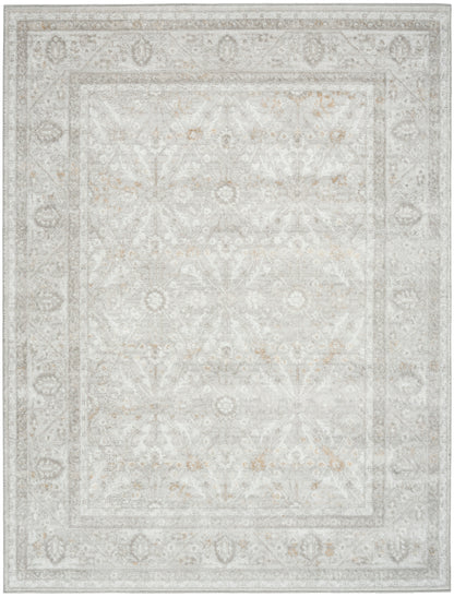 Soft beige-gray distressed oriental area rug with floral medallions and layered borders.
