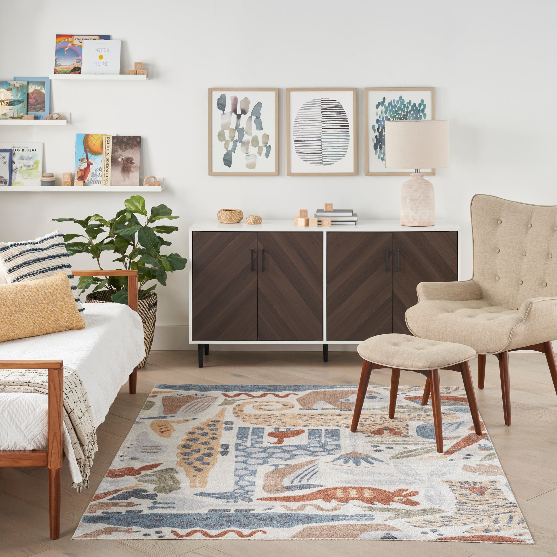 Bright mid-century living room with dark wood cabinet, beige armchair and ottoman, abstract rug, plant and wall art.