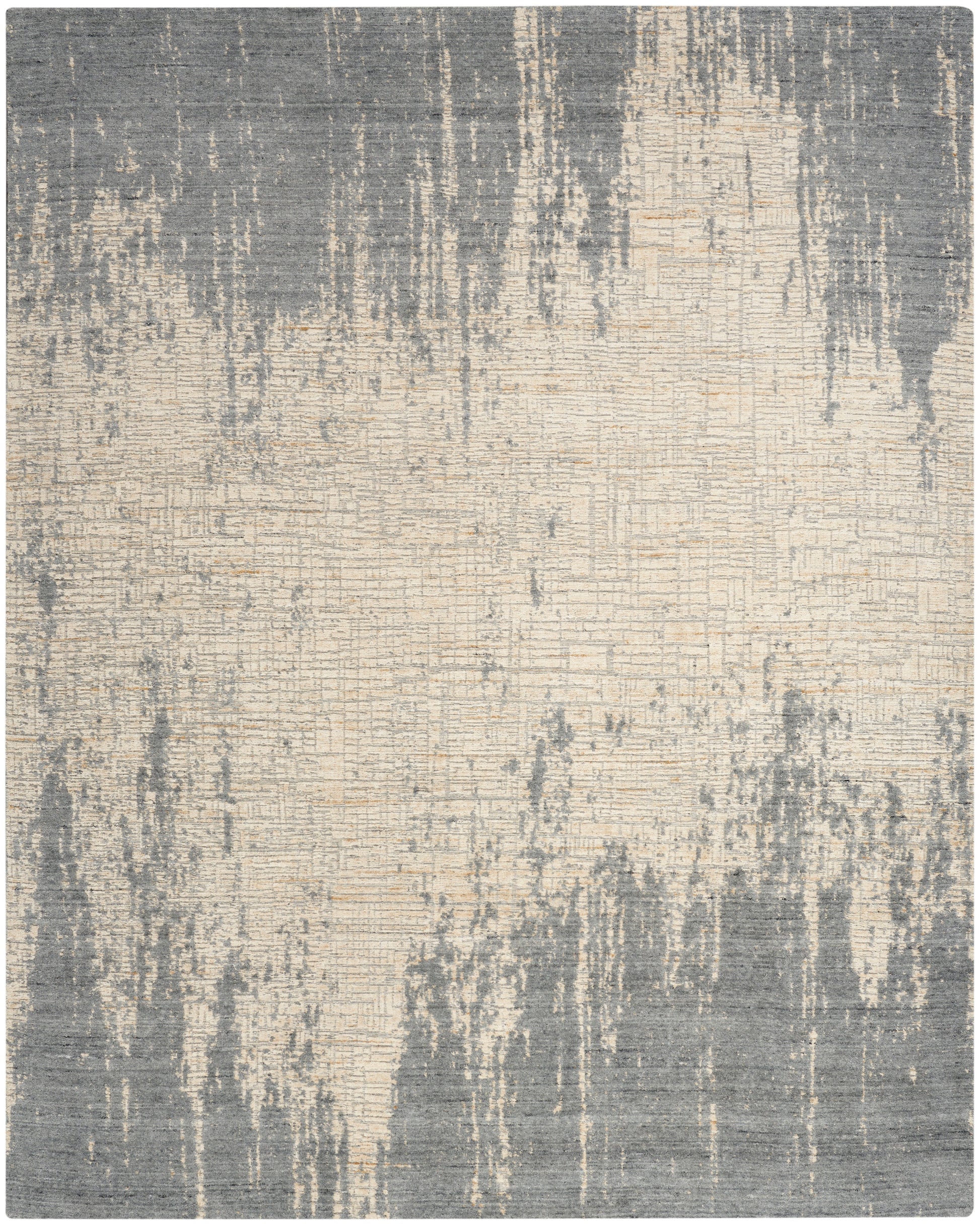 Abstract distressed area rug in grey and beige tones with a brushstroke pattern.