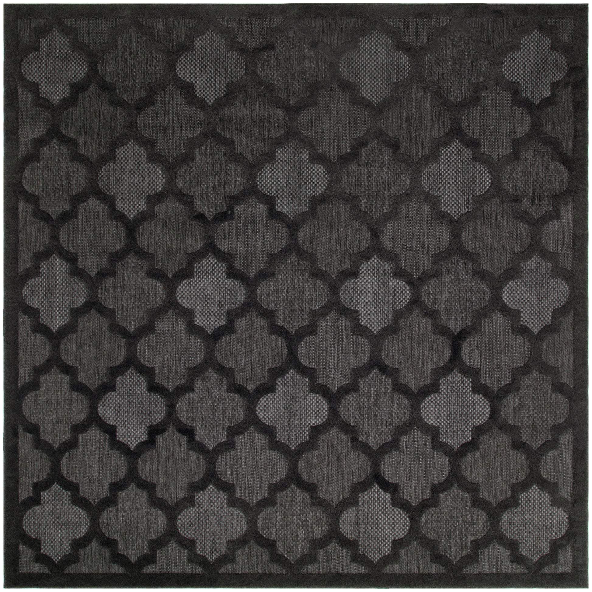 Charcoal-black square rug with a repeating quatrefoil lattice pattern and textured weave.