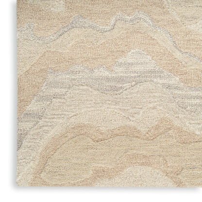 Beige shag rug with abstract cream & taupe wave pattern; plush textured pile for modern decor.