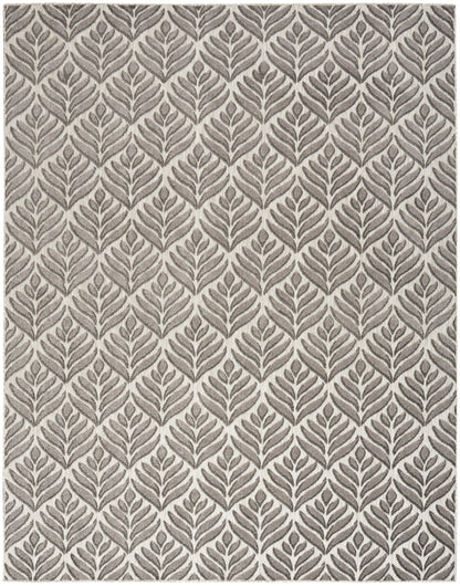 Gray area rug with taupe leaf motifs in a repeating tropical botanical pattern.