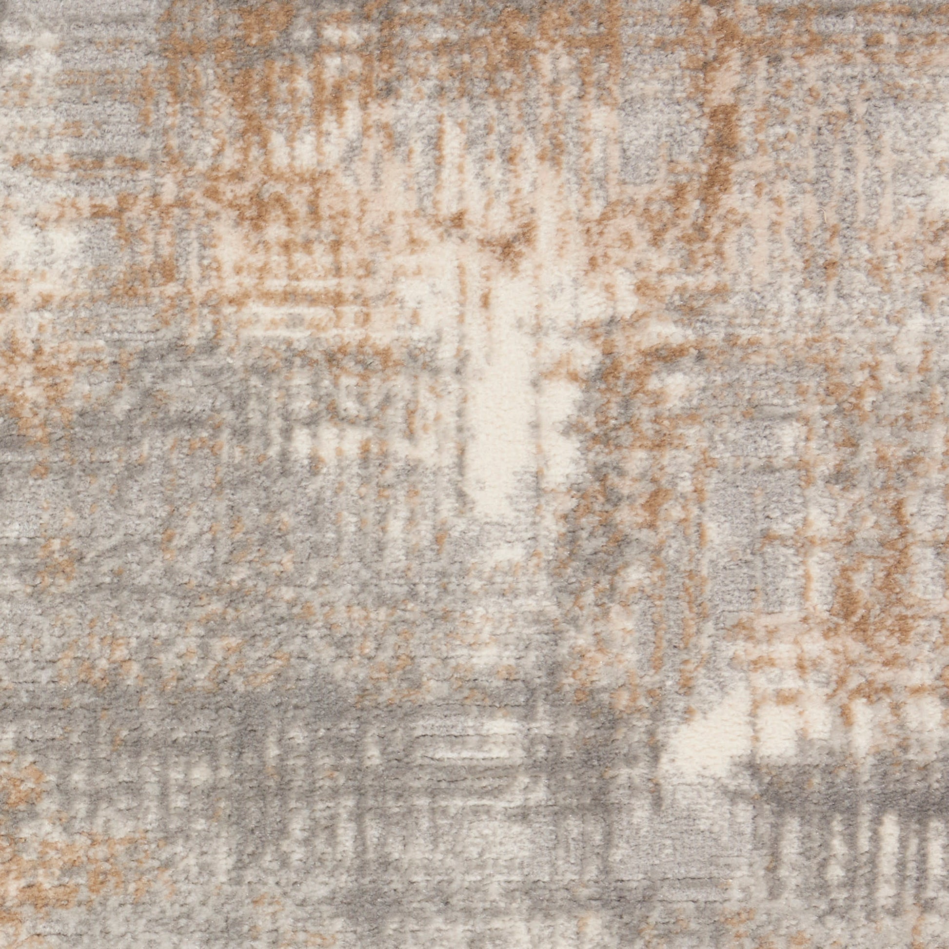 Rectangular area rug with an abstract distressed pattern in gray, beige and warm orange-brown; modern decor style.