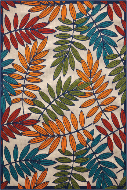 Vibrant woven rug with orange, teal, olive green and red leaf motifs on beige background; navy border.