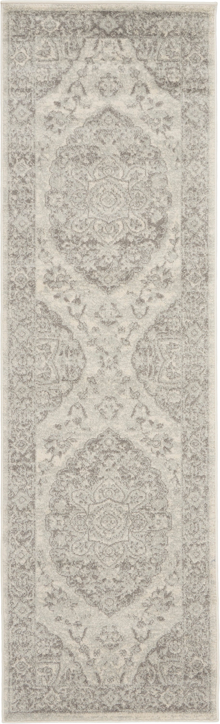 Beige-gray oriental rug runner with repeating medallions and ornate borders; distressed look for hallway or entry.