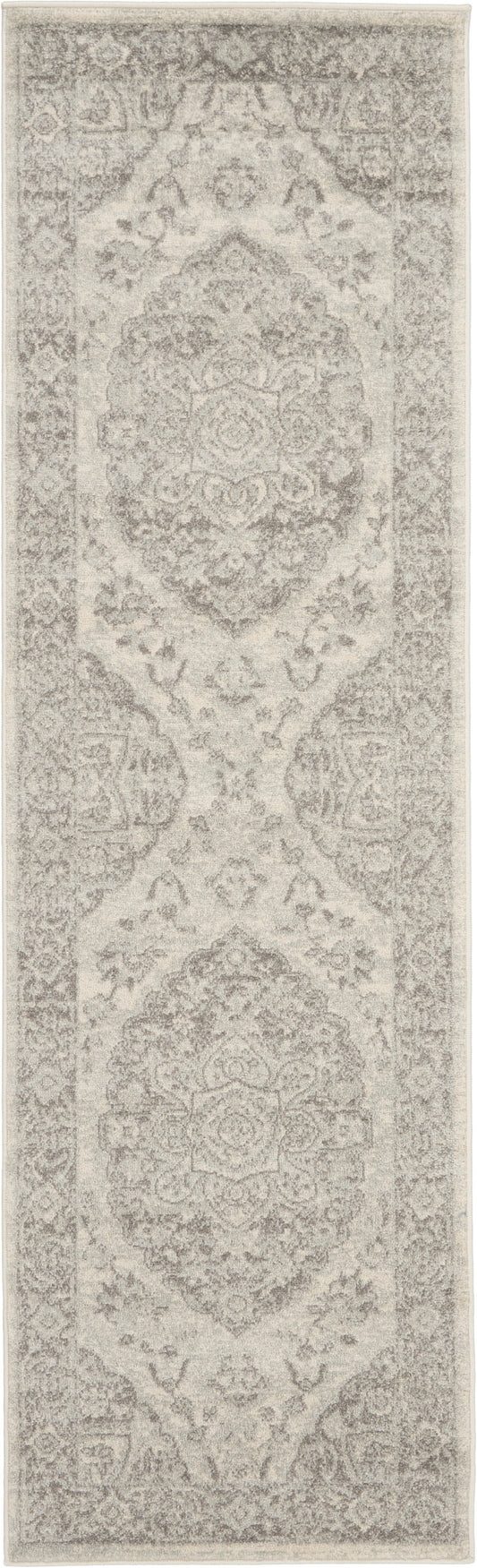 Beige-gray oriental rug runner with repeating medallions and ornate borders; distressed look for hallway or entry.
