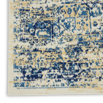 Distressed abstract blue and tan rug with cream base; vintage-inspired woven area rug.