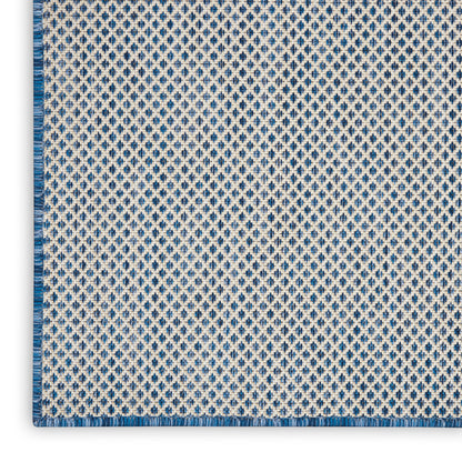 Grey gradient rug runner with blue and white geometric woven border along bottom edge.