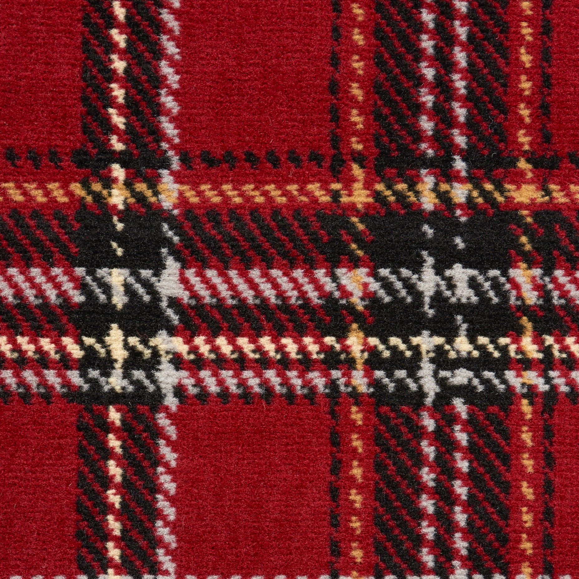 Red plaid wool rug with black, white and gold checks in a tartan pattern.