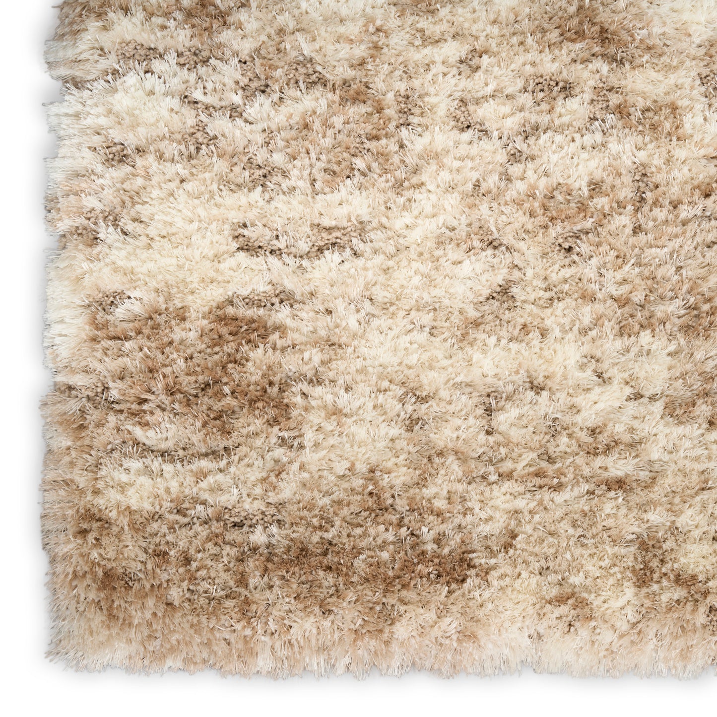 Beige & tan shag rug with long plush pile & soft, variegated texture.