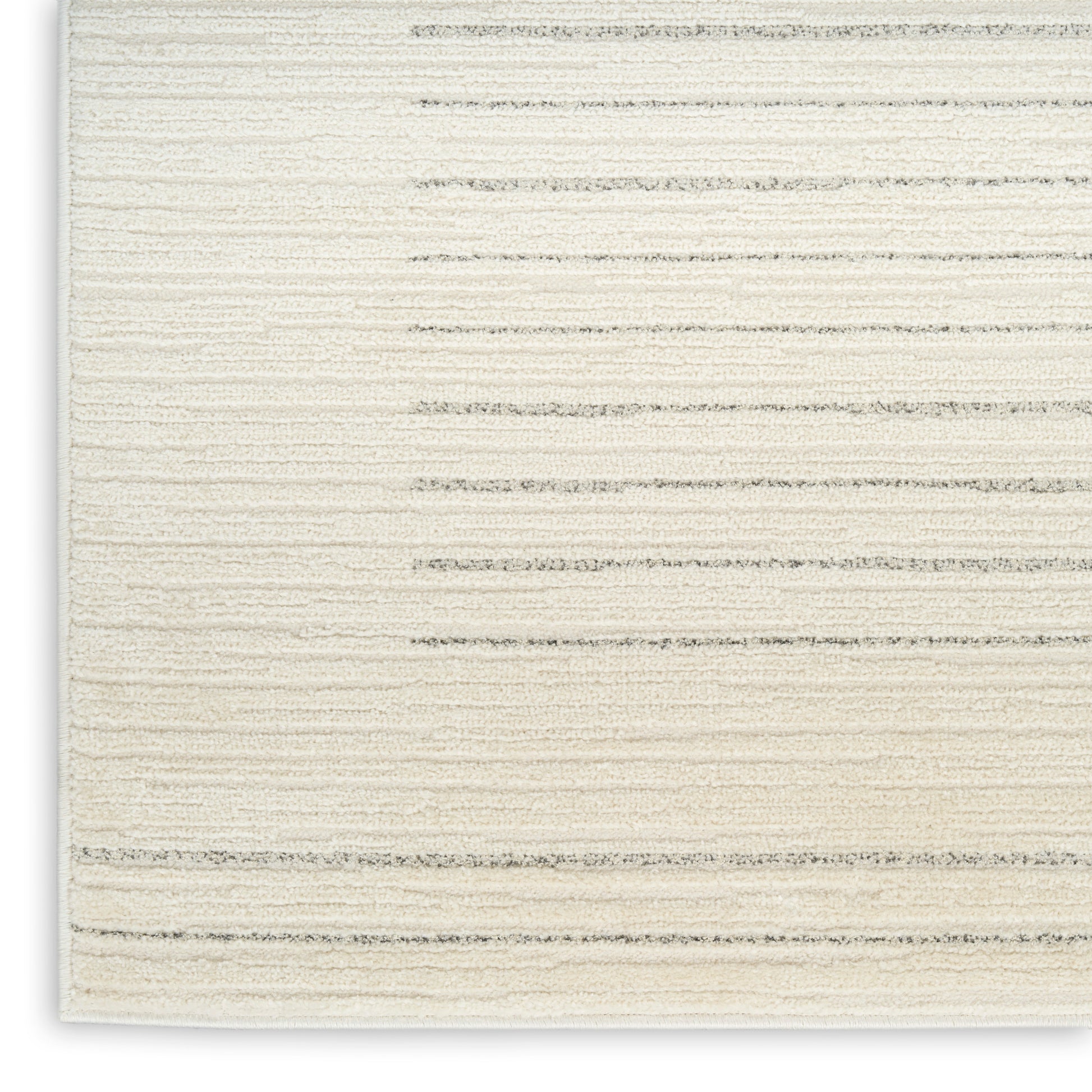 Cream textured rug close-up with pale gray horizontal stripes and soft woven pile.