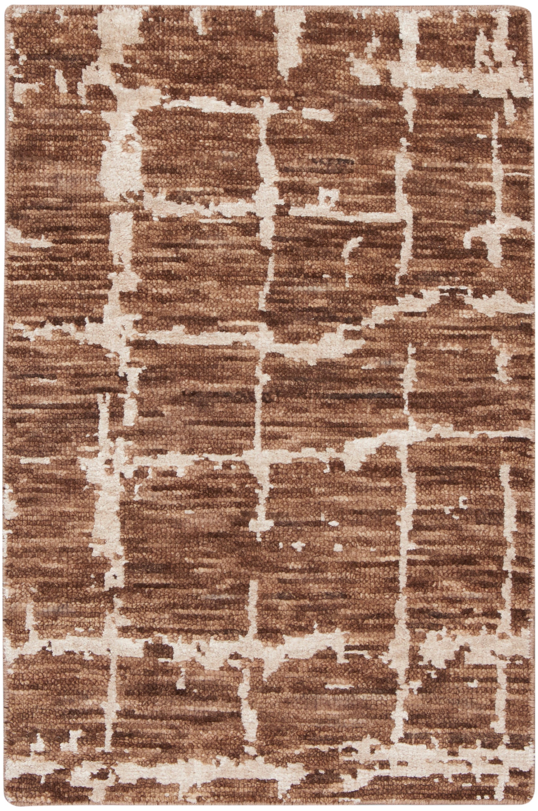 Brown and cream abstract area rug with geometric line pattern; plush short pile, rectangular.