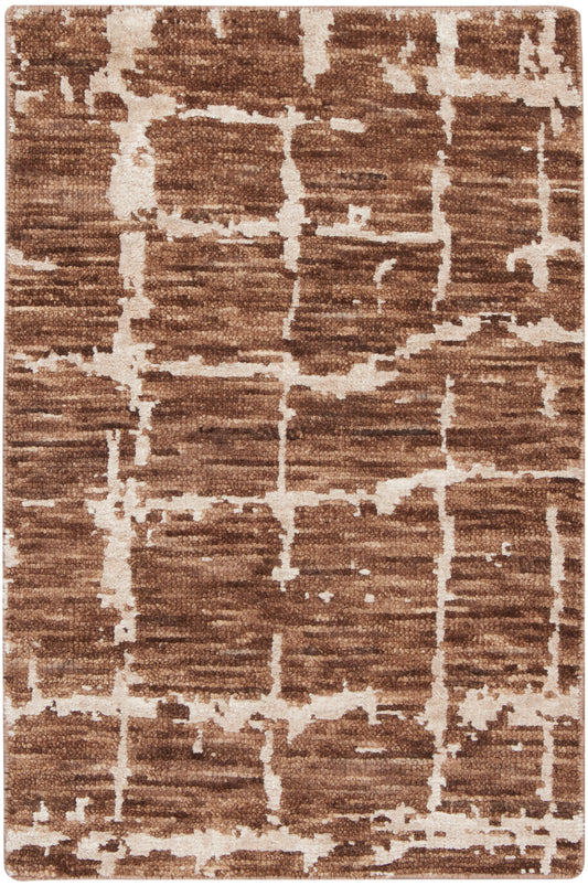 Brown and cream abstract area rug with geometric line pattern; plush short pile, rectangular.