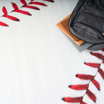 White round kids rug with red tassel fringe along the edge; soft knit texture, 5' diameter.