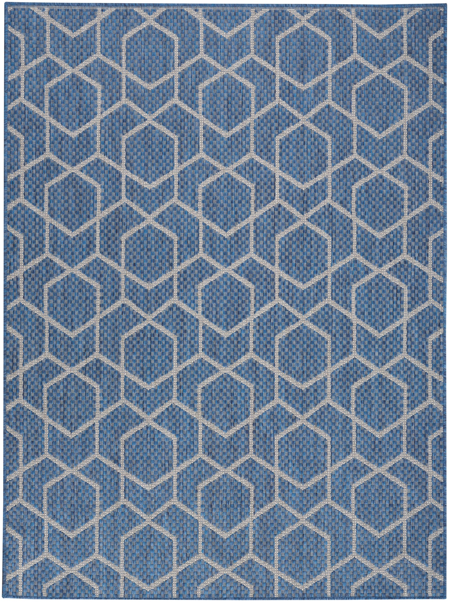 Blue woven rug with white interlocking hexagon lattice pattern; textured geometric decor.