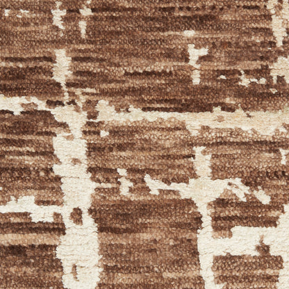Brown & beige shag rug with abstract geometric pattern and plush pile for living room decor.