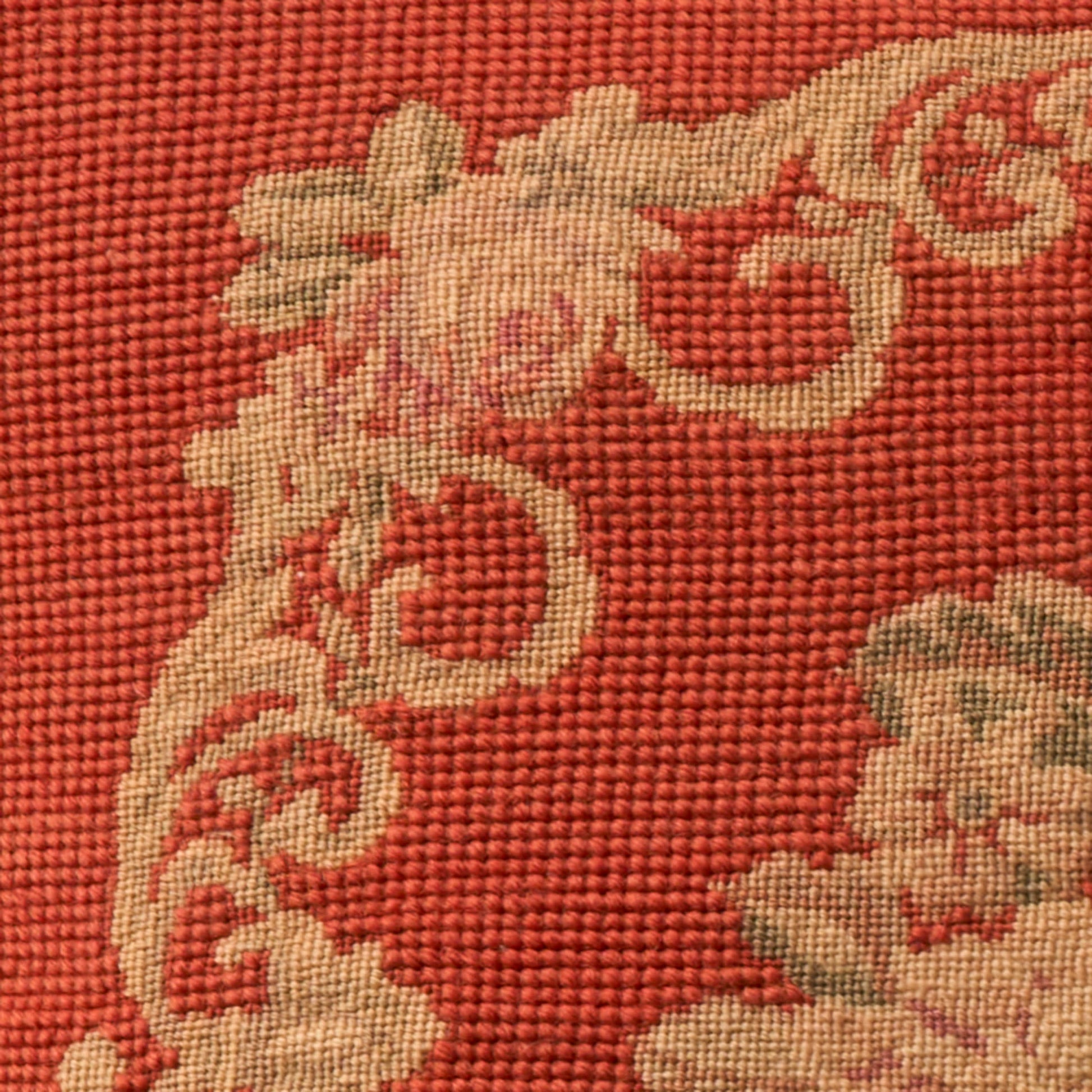 Red woven fabric with beige scrolling floral damask pattern; decorative 17 x 17 inch pillow.