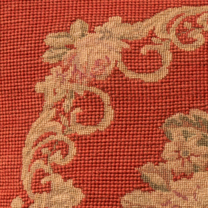 Red woven fabric with beige scrolling floral damask pattern; decorative 17 x 17 inch pillow.