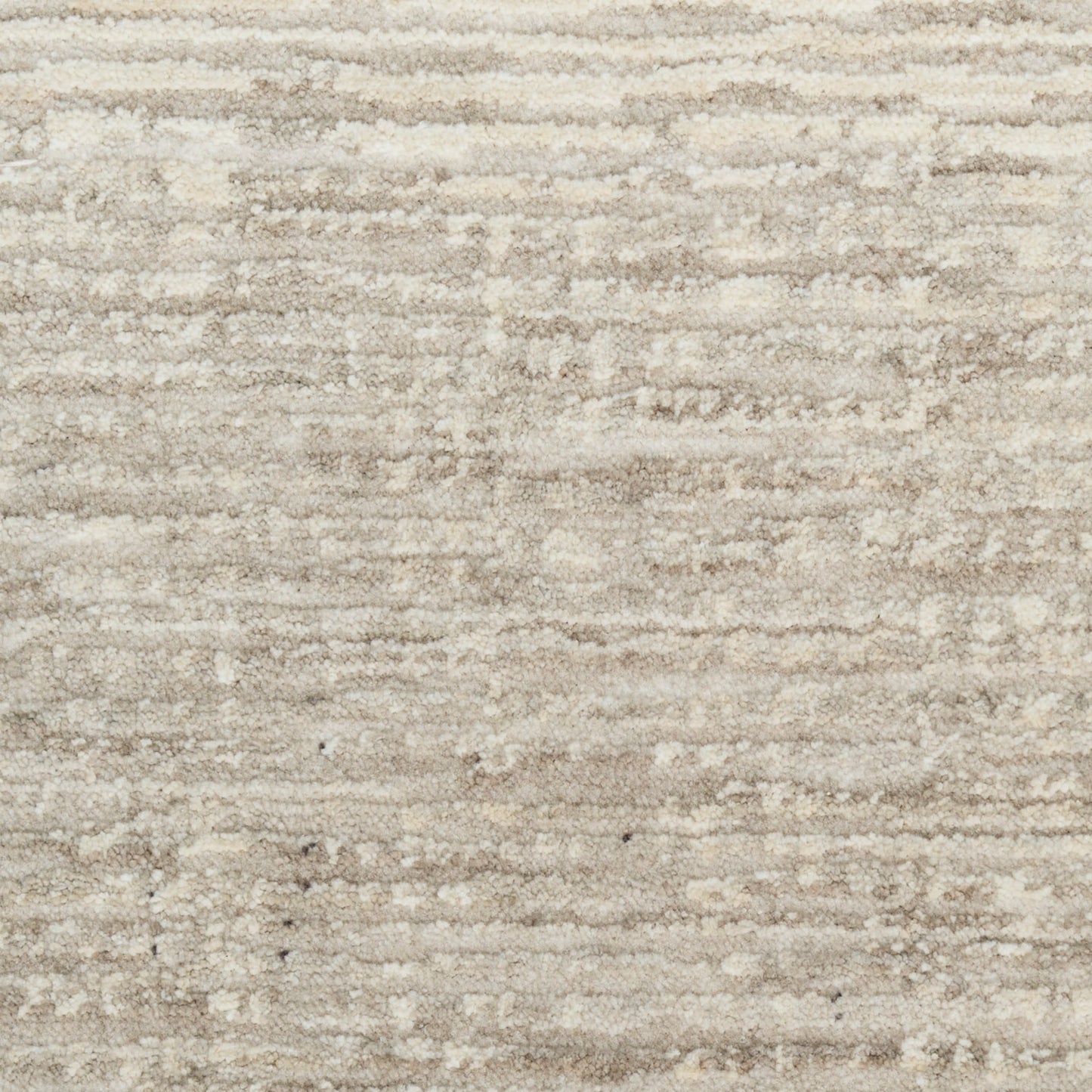 Cream and beige textured area rug with soft plush pile and subtle tonal stripes.