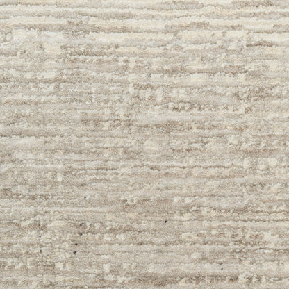 Cream and beige textured area rug with soft plush pile and subtle tonal stripes.