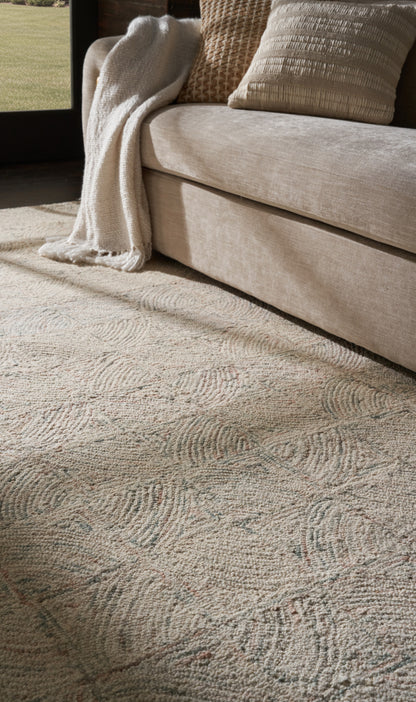 Light patterned beige area rug, 8' x 11'.