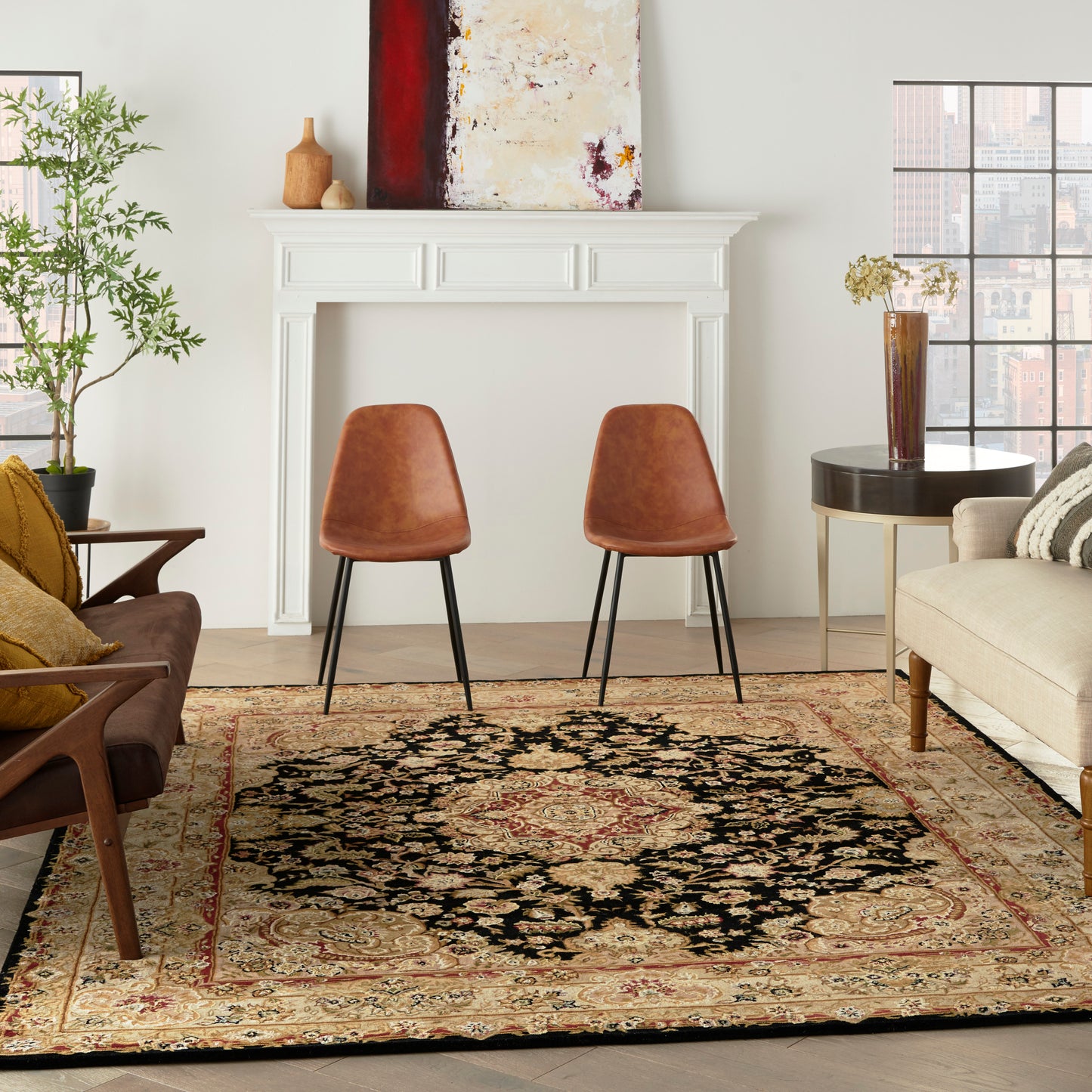 Cozy living room with white fireplace, mid-century chairs, ornate area rug, beige sofa, plant and abstract art.