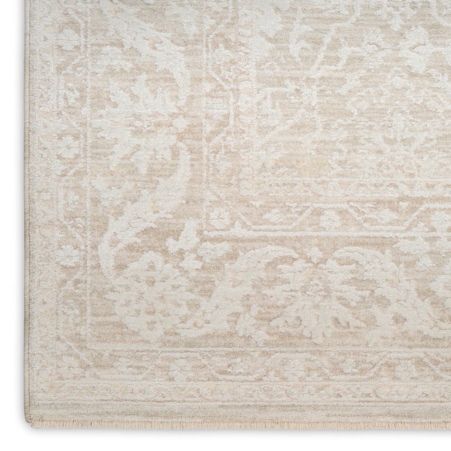 Beige cream Oriental area rug with a subtle distressed floral pattern and fringed border.