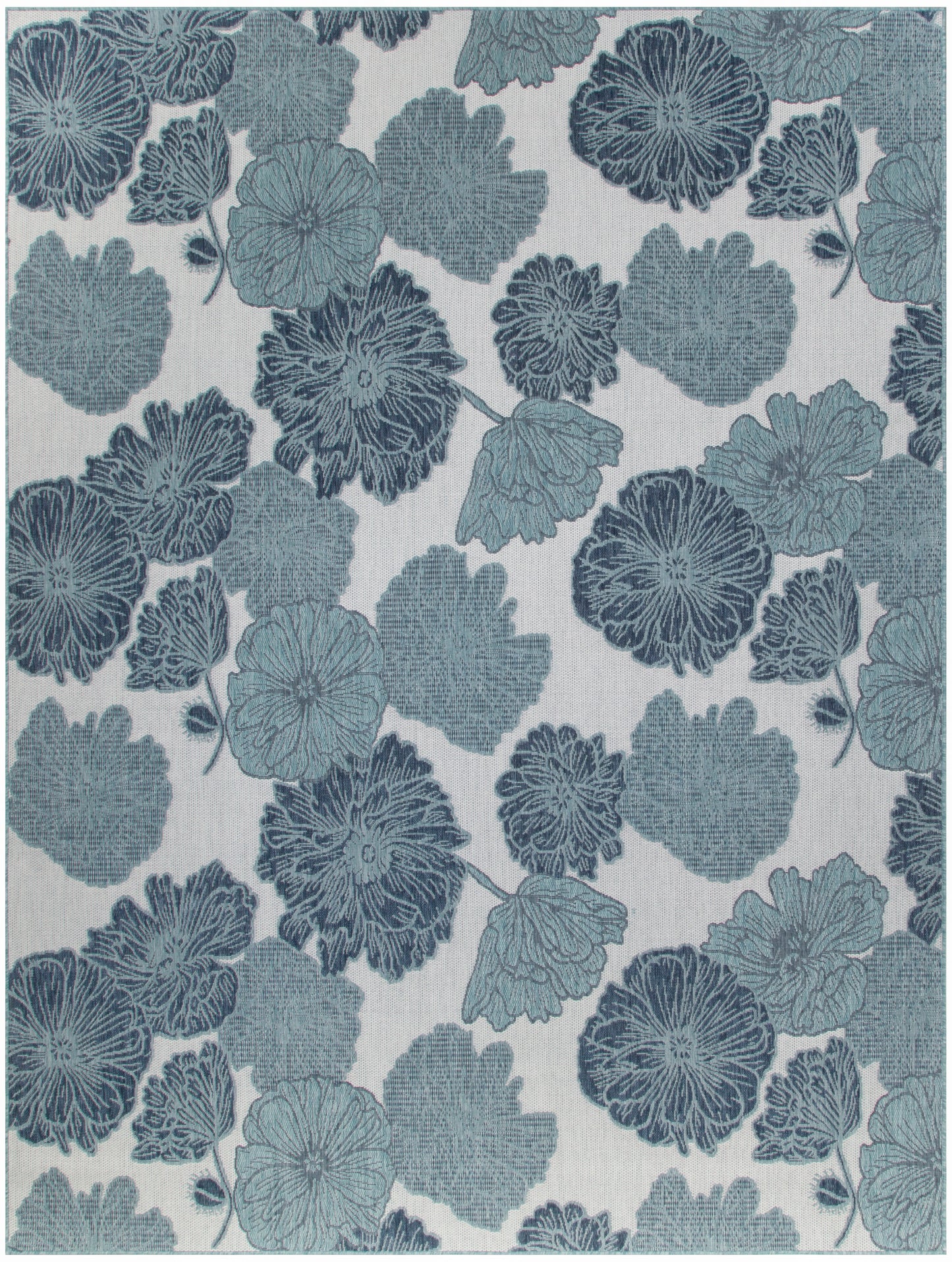 Blue floral jacquard textile pattern with large blossoms and leaves on a light beige background.