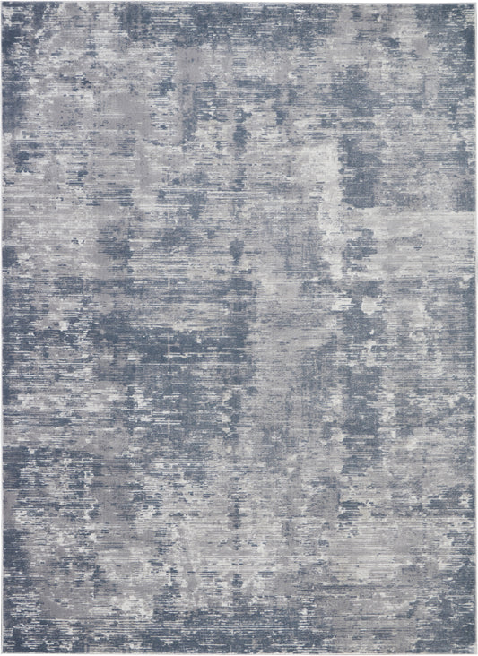 Blue-gray abstract distressed area rug in a modern contemporary style with soft, muted tones.