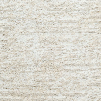 Cream shaggy rug close-up with plush, high-pile fibers and textured surface.