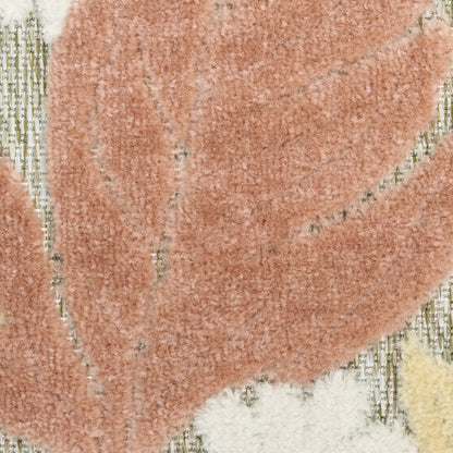 Peach shag rug with abstract cream leaf shapes; plush, textured pile for living room decor.
