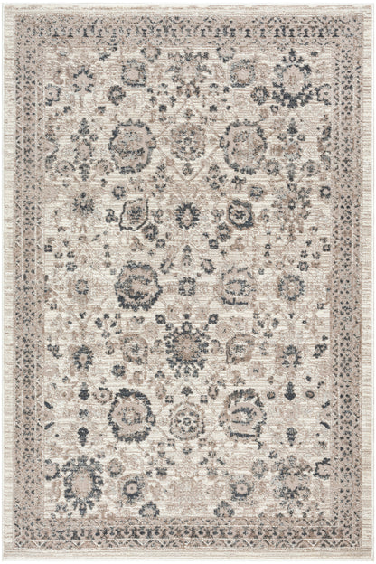 Rectangular beige oriental rug with blue-gray floral medallions, ivory background, and an ornate border.