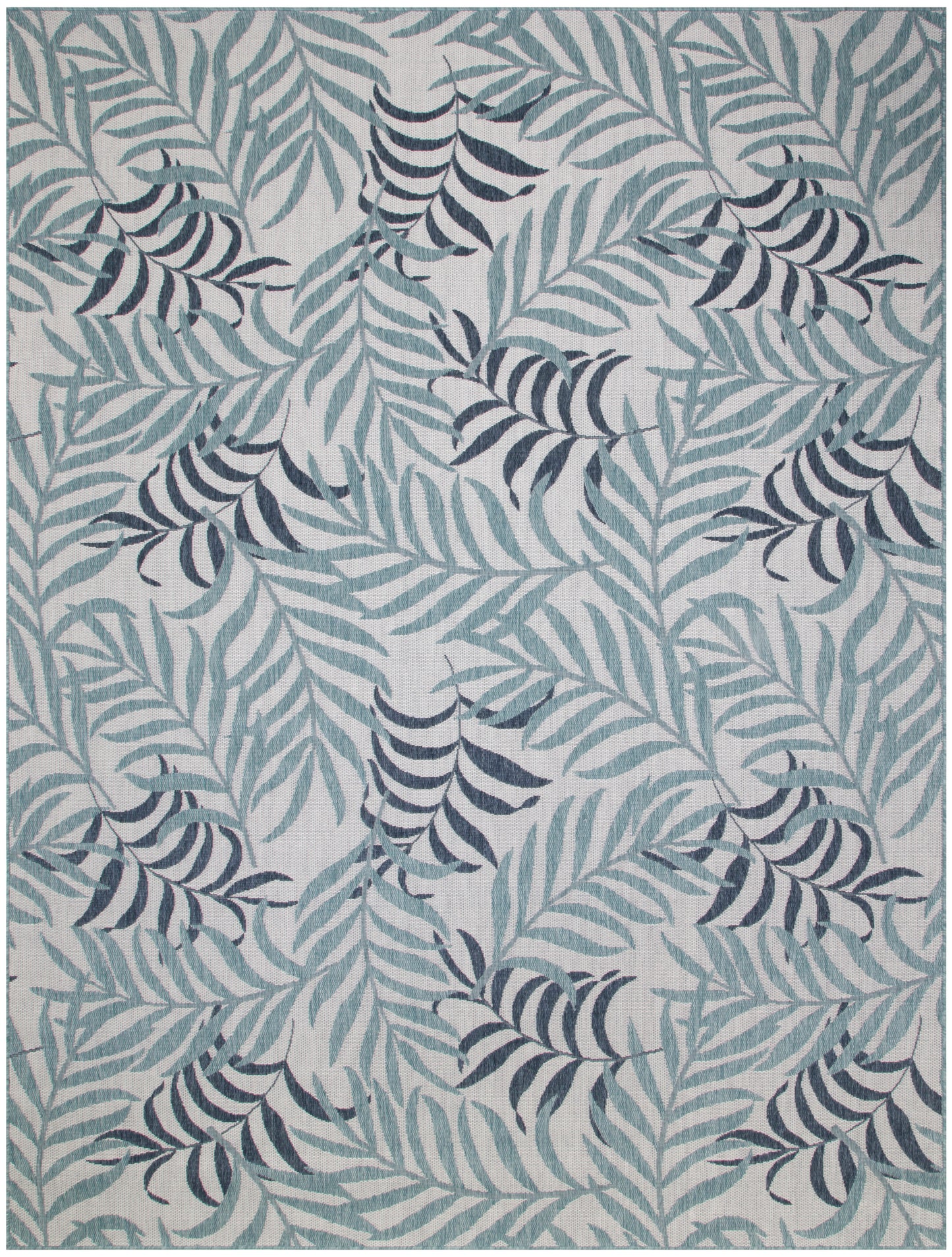 Light gray area rug with blue-teal and navy palm leaves in a botanical pattern.