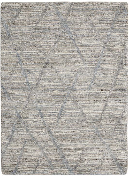 Rectangular beige-gray rug with soft, textured pile and subtle overlapping diamond pattern.